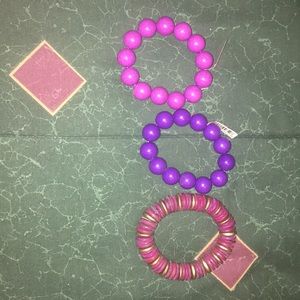 3 purple bracelets